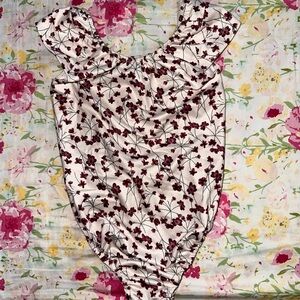 Two Bailey’s Blossoms bodysuits